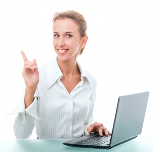 friendly administrative assistant at the desk with a laptop