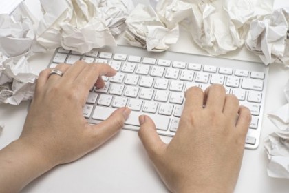 Business concept. keyboard and crumpled paper on table.